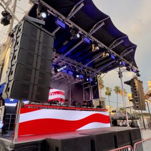 Stageline SL100 mobile stage with flown line array audio, LED video wall, and concert lightingfor an outdoor event in Florida